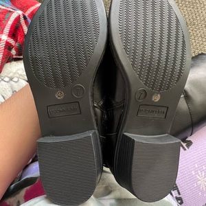 Black riding boots. Never worn.